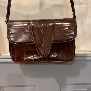 Beautiful never used : beautiful brown leather eel skin pocketbook. Meas12x8